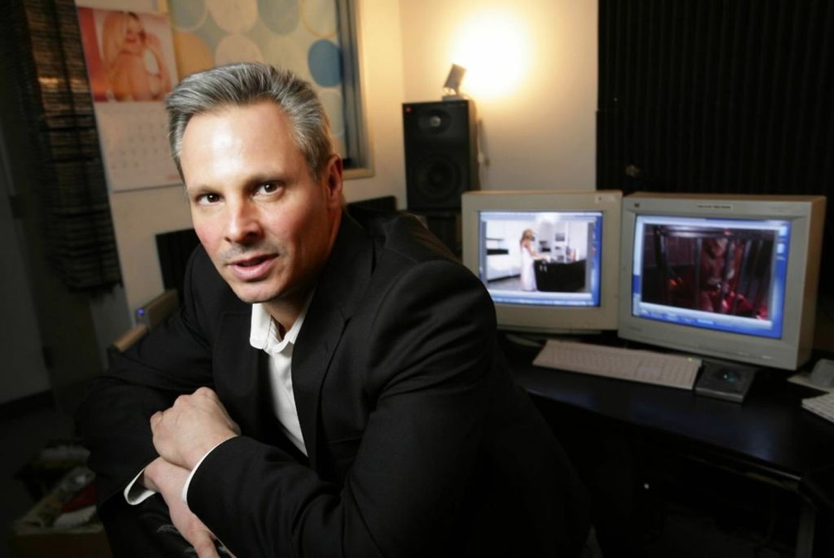 Steven Hirsch, co-founder of Vivid Entertainment, sits in a sound editing office in Los Angeles, California, February 2, 2006. Hirsch plans to launch a new product this year for mobile-phone users. (P ...