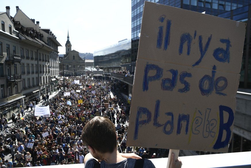 People attend a &#039;National Climate Strike&#039; demonstration in Bern, Switzerland, Saturday, Sept. 28, 2019. Thousands of people, young and old, are staging a protest in the Swiss capital Bern ca ...