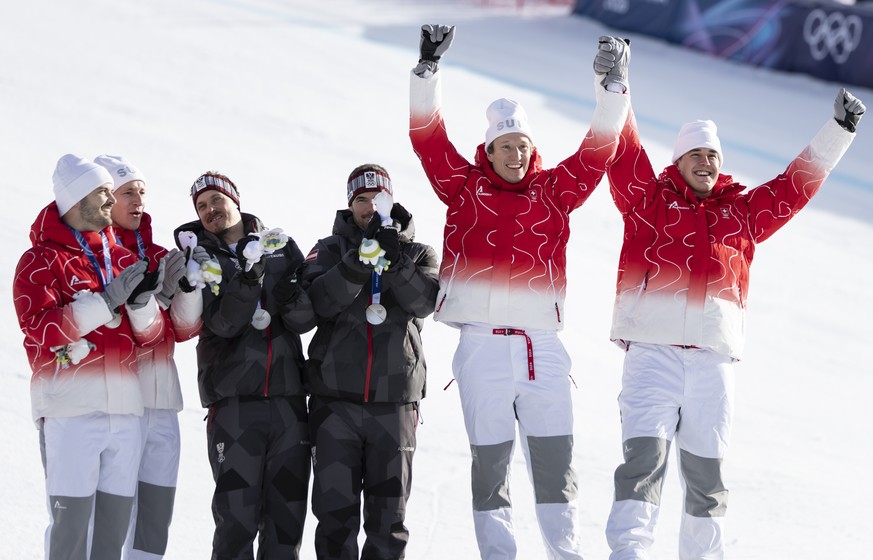 From left: second placed Switzerland's Loic Meillard, Switzerland's Marco Odermatt, Austria's Manuel Feller, Austria's Vincent Kriechmayr celebrate their medals at the ceremony wit ...