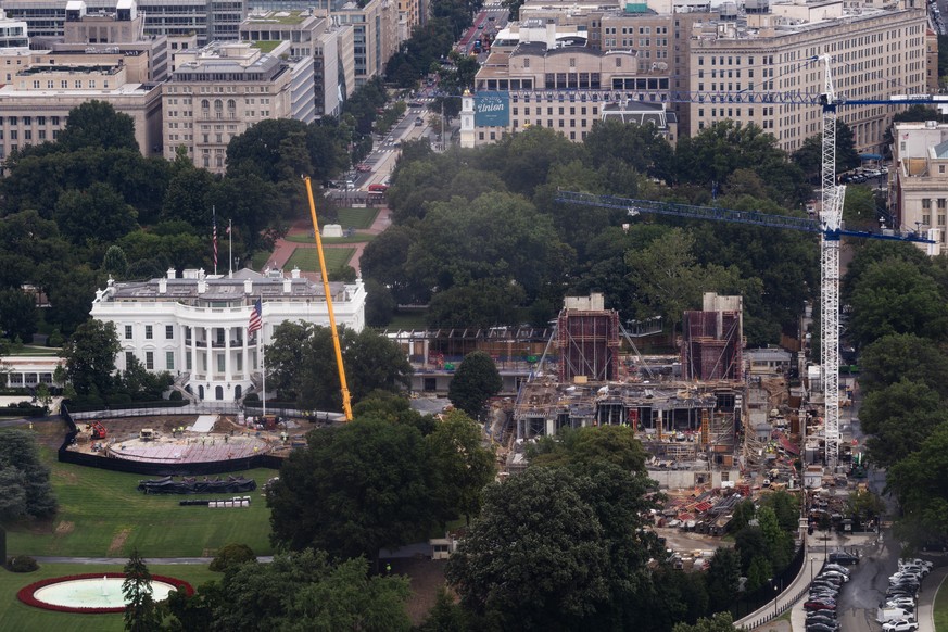 Construction continues on a helipad and the White House Ballroom on the South Lawn of the White House, Wednesday, Aug. 5, 2026, in Washington. (AP Photo/Tierney L. Cross)
White House Construction