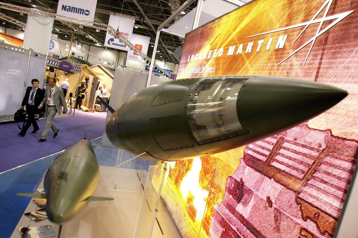 epa01117155 Visitors to the Defence Systems and Equipment Internatinal expo walk past Lockheed Martin missiles in London, 11 September 2007. Companies from across the globe decended upon the London do ...
