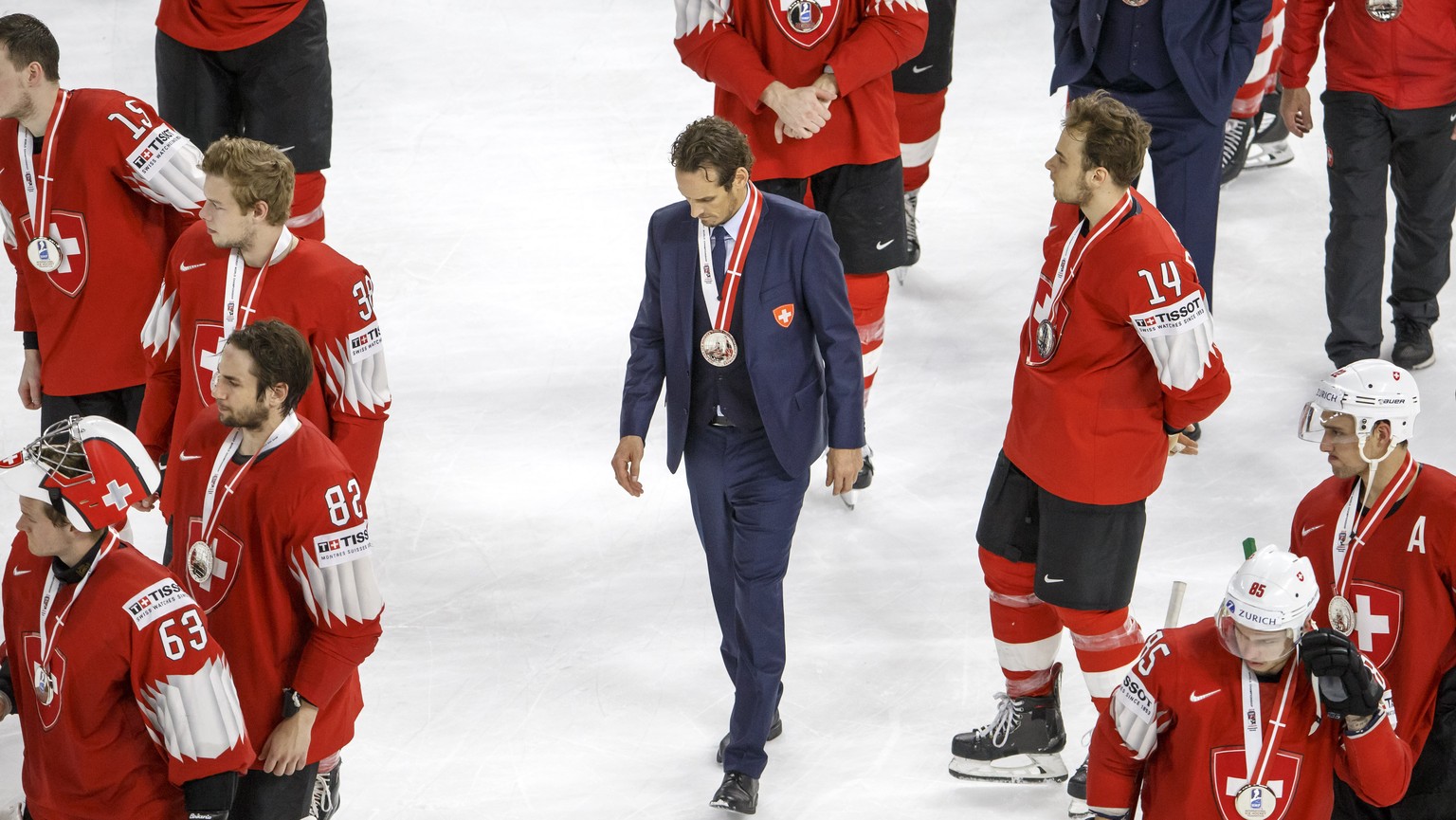 Patrick Fischer, centre, head coach of Switzerland national ice hockey team, between his look disappointed after losing against team Sweden, during the shootout of the IIHF 2018 World Championship Gol ...