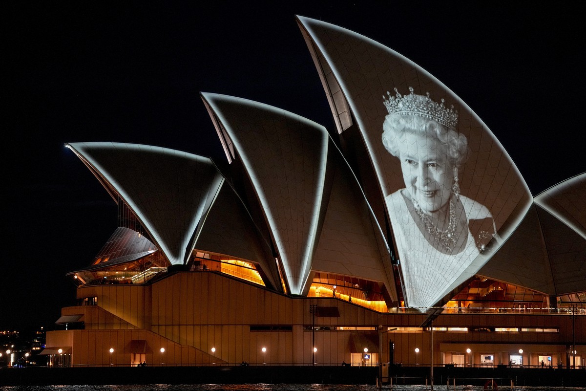 The Sydney Opera House is illuminated with a portrait of Queen Elizabeth II in Sydney, Australia, Friday, Sept. 9, 2022. Queen Elizabeth II, Britain's longest-reigning monarch and a rock of stabi ...