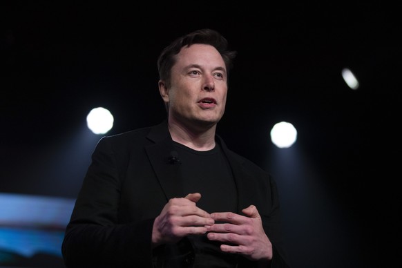 FILE - In this March 14, 2019, file photo, Tesla CEO Elon Musk speaks before unveiling the Model Y at the company&#039;s design studio in Hawthorne, Calif. Musk is asking on Twitter whether he should  ...
