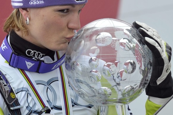Germany's Maria Riesch kisses the crystal globe as overall winner of this year's World Cup in alpine skiing at the FIS Alpine Ski World Cup finals, in Parpan - Lenzerheide, Switzerland, Satu ...