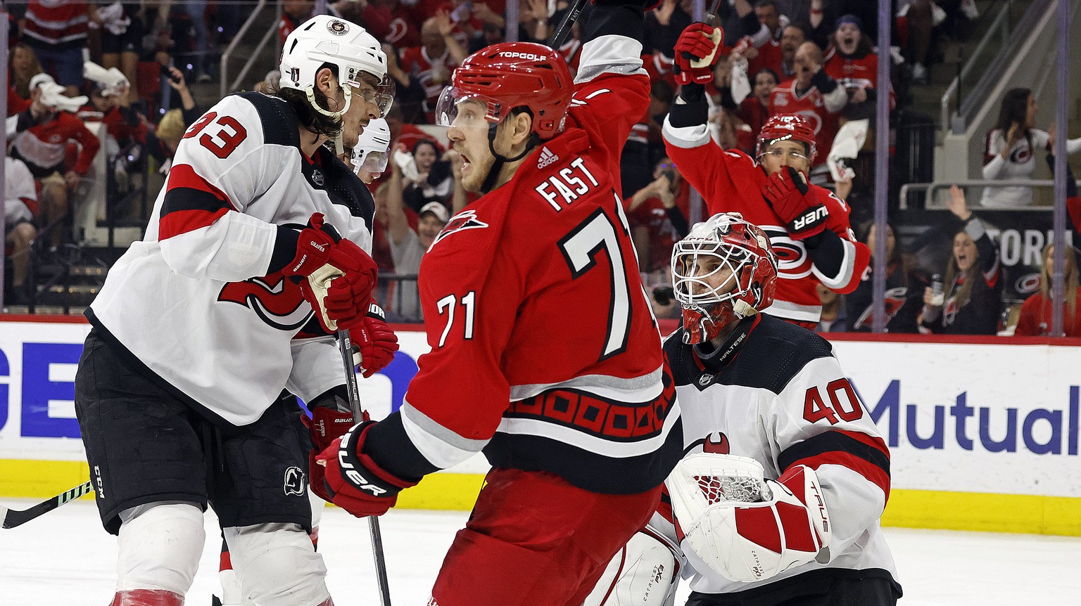 Carolina Hurricanes&#039; Jesper Fast (71) celebrates his overtime goal against New Jersey Devils goaltender Akira Schmid (40) during Game 5 of an NHL hockey Stanley Cup second-round playoff series in ...