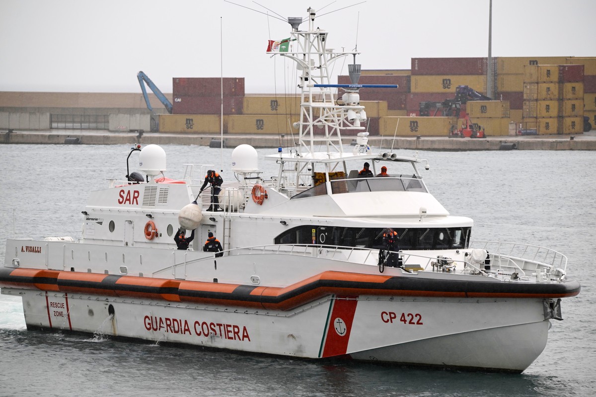 FILE - An Italian Coast Guard ship taking back the first 12 migrants from a newly opened asylum processing center in Shengjin, Albania, arrives in the harbor of Bari, in southern Italy, on Saturday, O ...