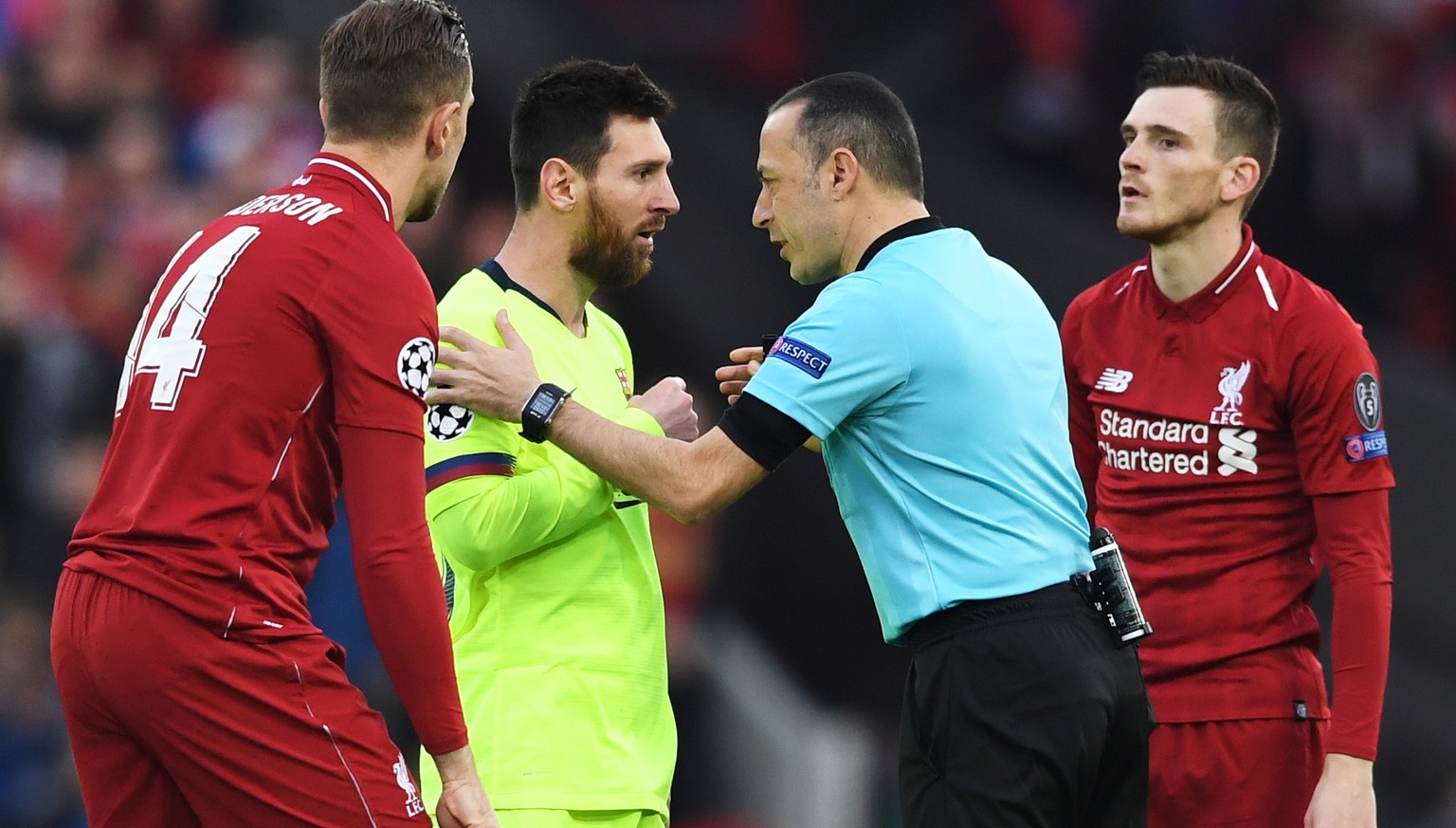 epa07554490 Lionel Messi (C-L) of Barcelona and Turkish referee Cuneyt Cakir (C-R) react during the UEFA Champions League semi final second leg soccer match between Liverpool FC and FC Barcelona at An ...