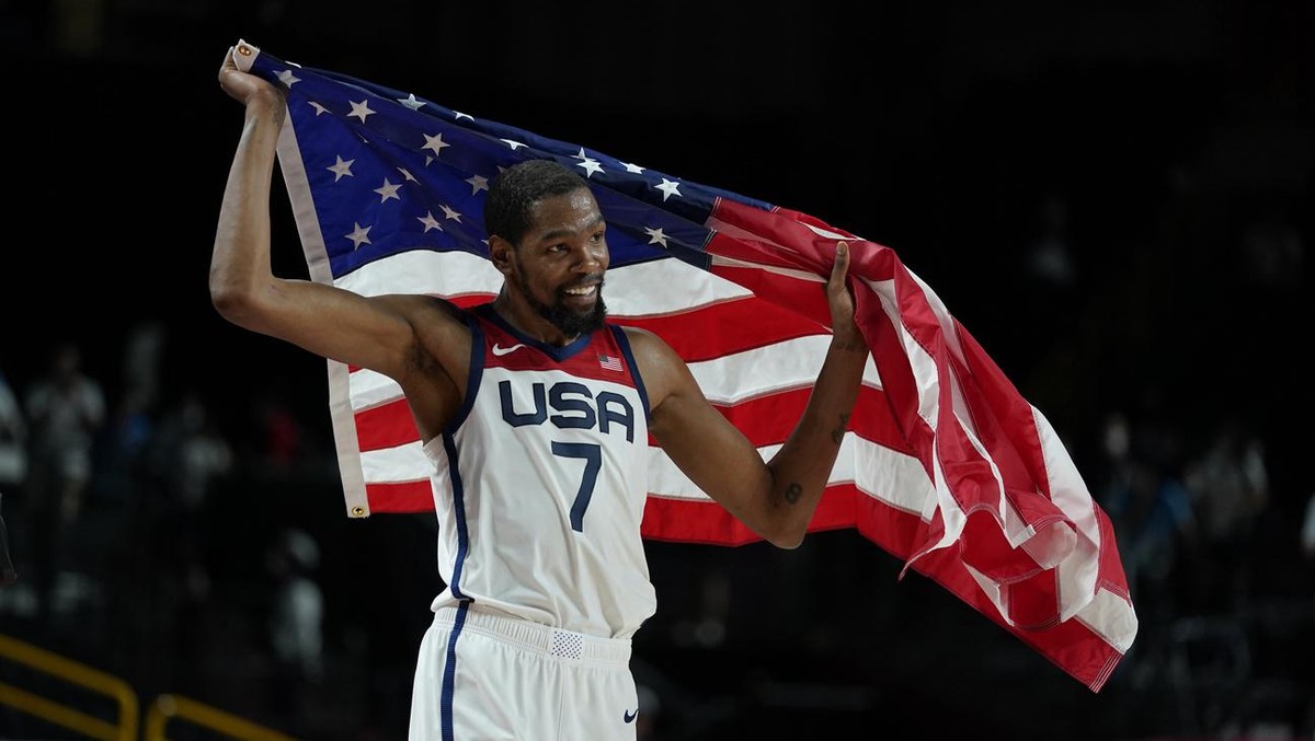 United States' Kevin Durant (7) celebrates after their win in the men's basketball gold medal game against France at the 2020 Summer Olympics, Saturday, Aug. 7, 2021, in Saitama, Japan. (AP  ...