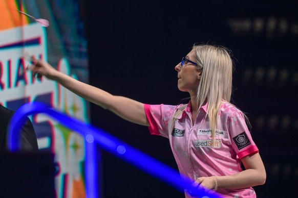 epa09954415 Fallon Sherrock of England in action against Gerwyn Price of Wales during the Hungarian Darts Show at the MVM Dome in Budapest, Hungary, 17 May 2022 (issued 18 May 2022). EPA/Tibor Illyes ...