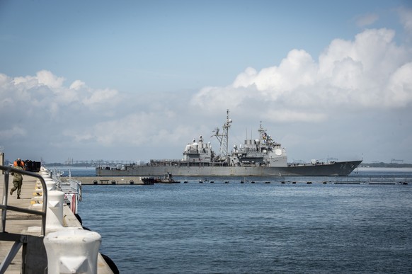 epa07011363 A handout photo made available by the Navy Office of Information shows The guided-missile destroyer USS Mahan (DDG 72) departs Naval Station Norfolk, Virginia, USA 10 September 2018. There ...