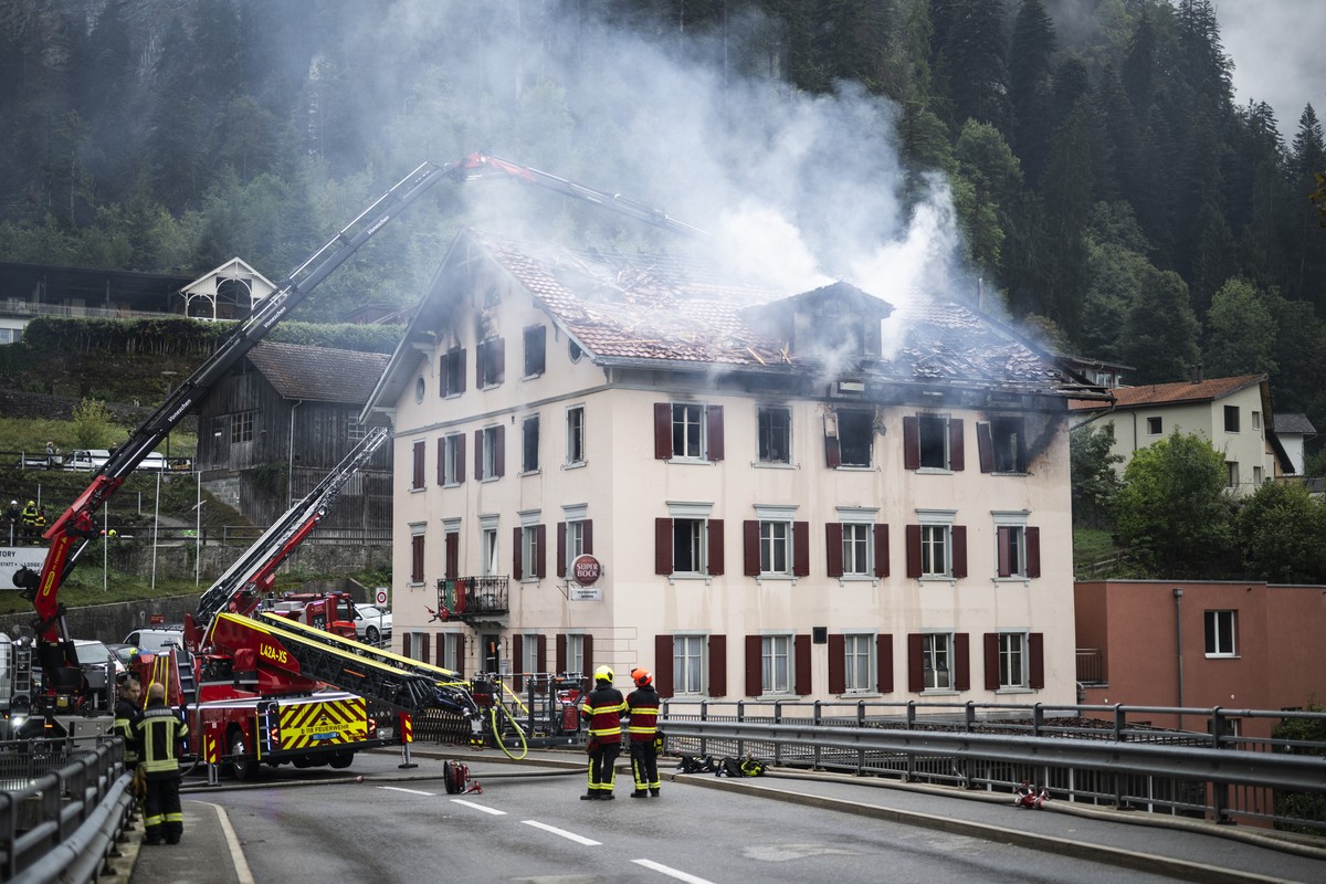 epa13182441 Firefighters try to put out a fire at a building with a restaurant and apartments in Thusis in eastern Switzerland, 21 August 2026. Five people are reported missing following a major fire, ...