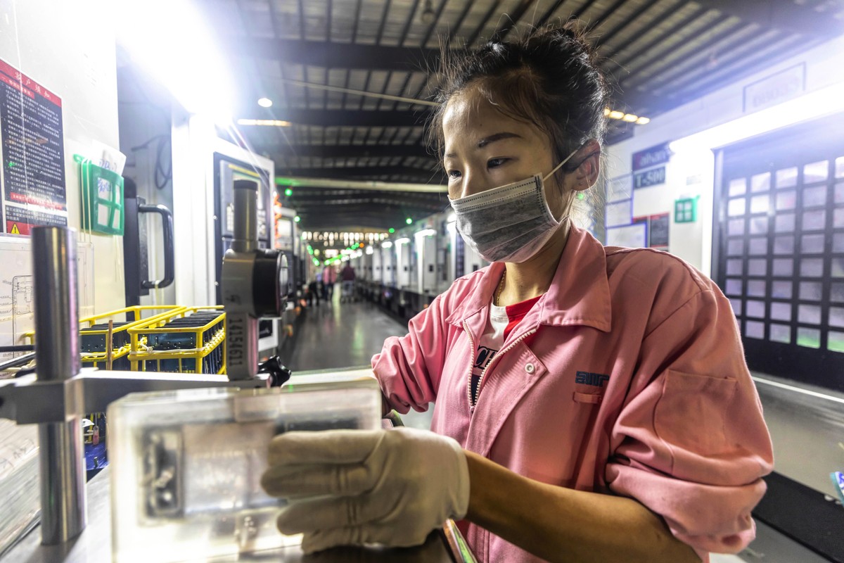 epa07558236 A woman works in Everwin precision technology factory in Dongguan, Guangdong Province, China, 09 May 2019.
Everwin is Asia's largest intelligent processing workshop, they produce cas ...