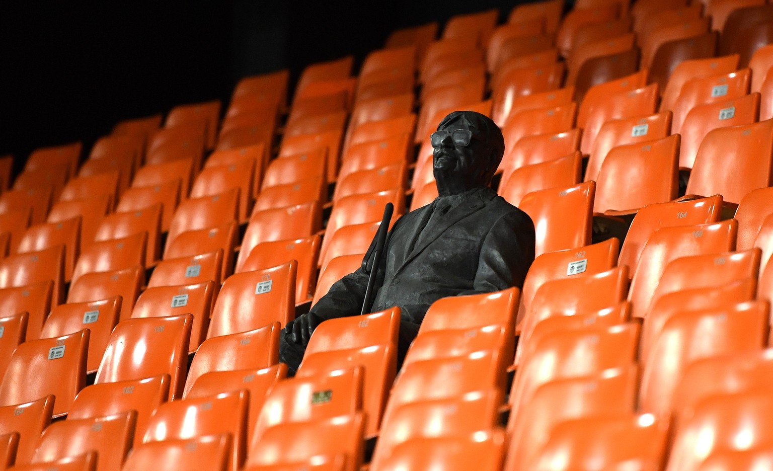 epa08284359 A handout image provided by UEFA shows a statue in the stands representing a former fan ahead of the UEFA Champions League round of 16 second leg match between Valencia CF and Atalanta BC  ...