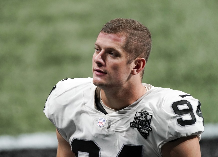 FILE - In this Nov. 29, 2020, file photo, Las Vegas Raiders defensive end Carl Nassib leaves the field after an NFL football game against the Atlanta Falcons in Atlanta. Nassib on Monday, June 21, 202 ...