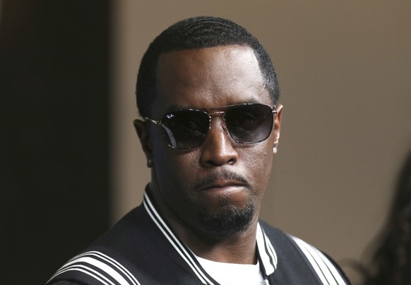 FILE - In this May 30, 2018, file photo, Sean Combs arrives at the LA Premiere of &quot;The Four: Battle For Stardom&quot; at the CBS Radford Studio Center in Los Angeles. Combs has pledged $1 million ...