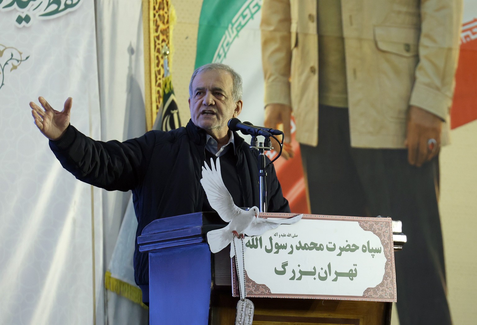 epa12620982 Iranian president Masoud Pezeshkian speaks during the sixth anniversary of late Iran's Islamic Revolutionary Guard Corps (IRGC) Quds Force commander Qasem Soleimani death, in Tehran,  ...