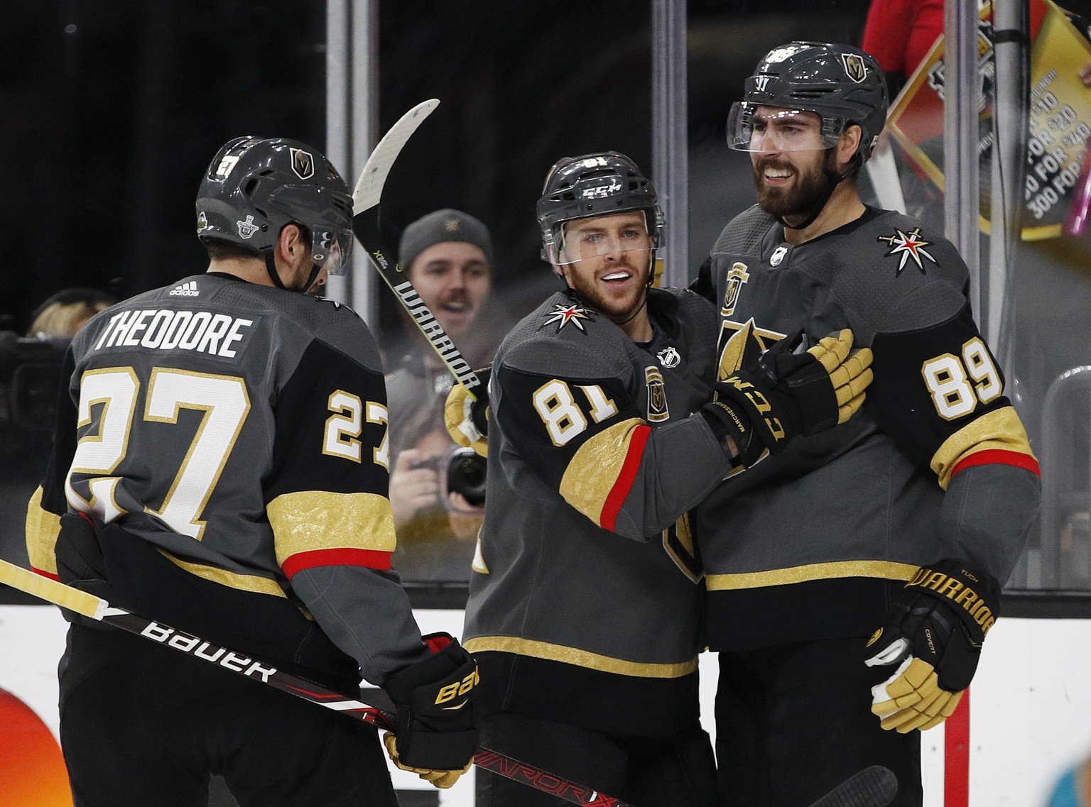 Vegas Golden Knights center Jonathan Marchessault, center, congratulates right wing Alex Tuch (89), who scored against the San Jose Sharks during the second period of Game 5 of an NHL hockey second-ro ...