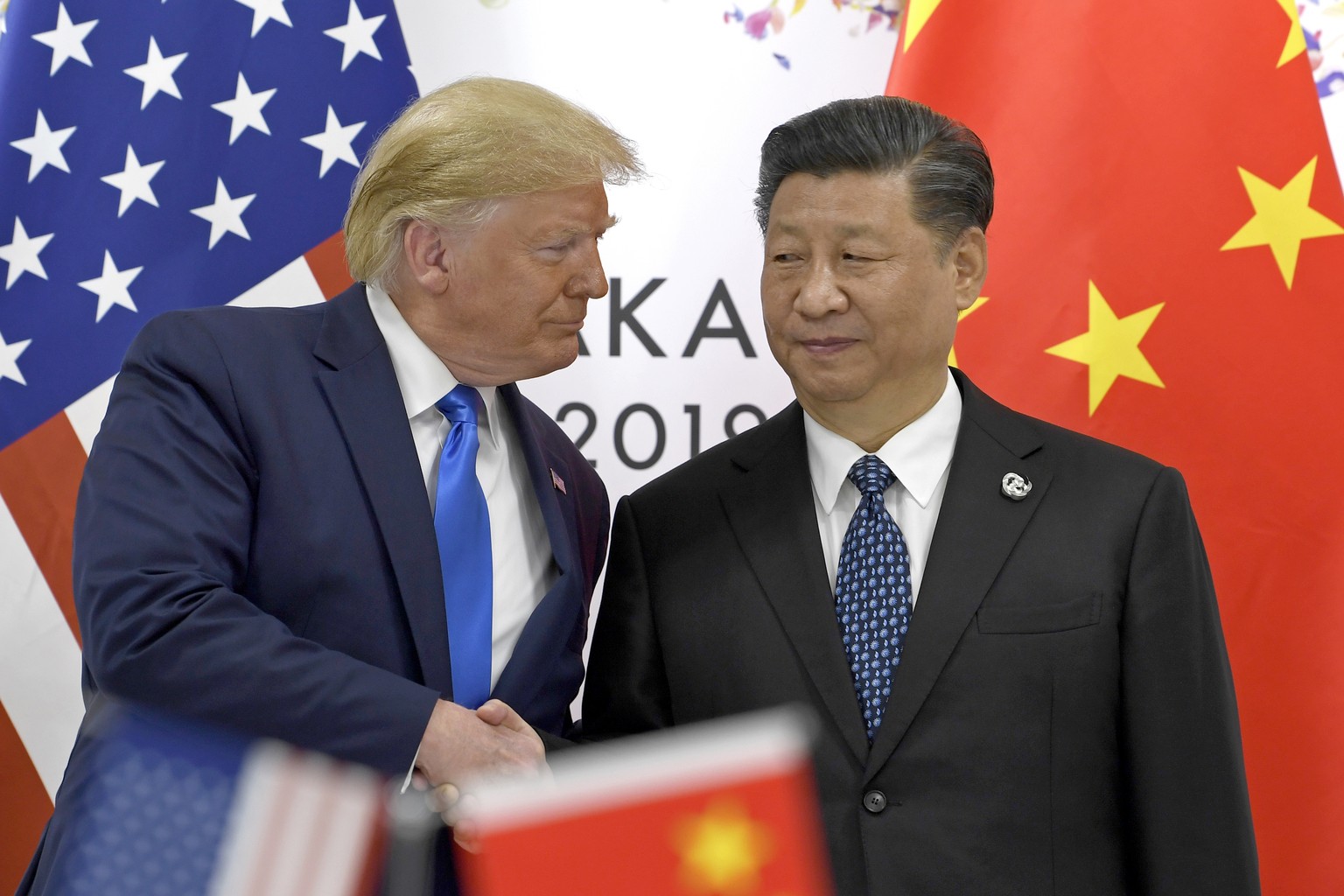 President Donald Trump, left, shakes hands with Chinese President Xi Jinping during a meeting on the sidelines of the G-20 summit in Osaka, Japan, Saturday, June 29, 2019. (AP Photo/Susan Walsh)
Donal ...