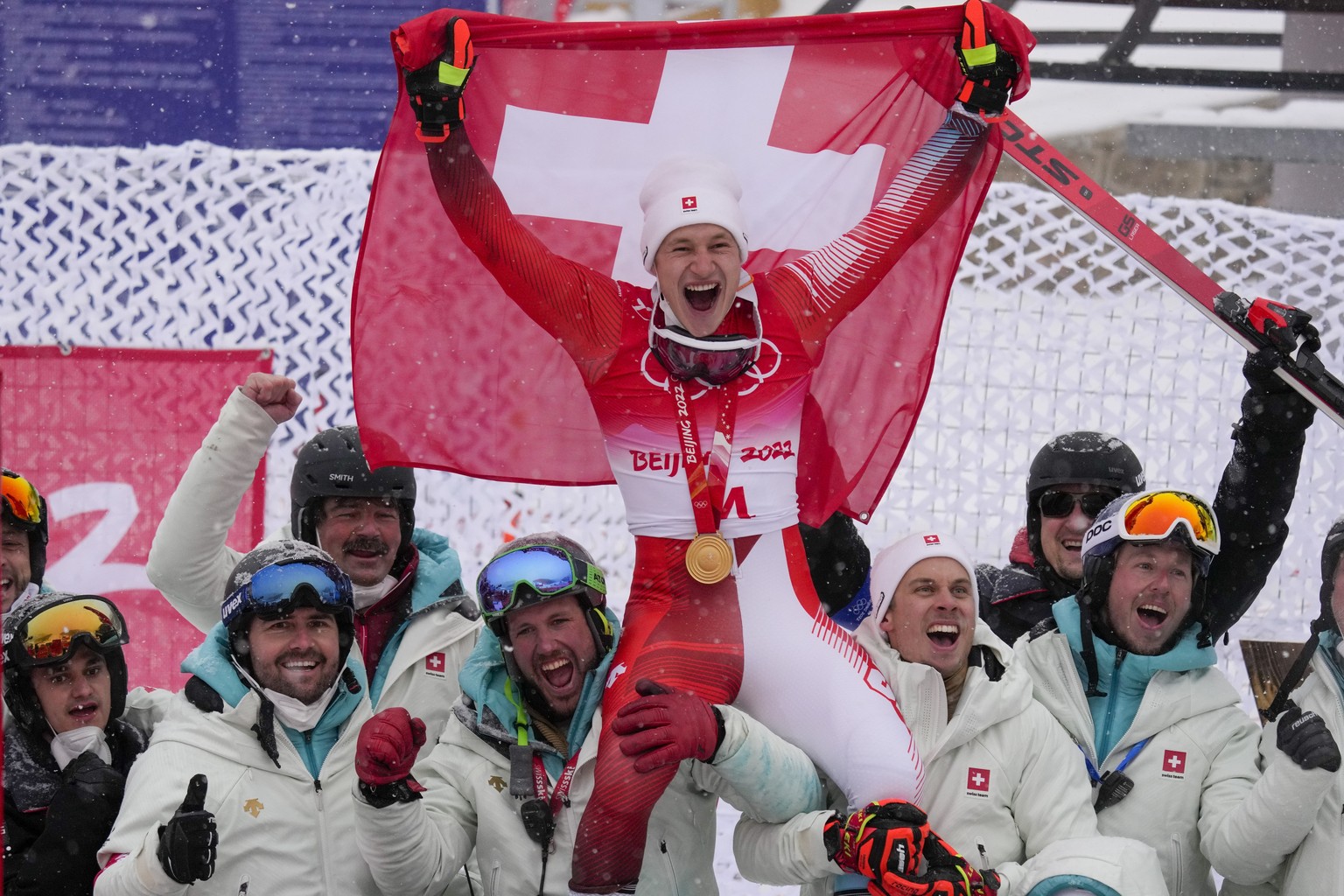 Marco Odermatt, of Switzerland, celebrates winning the gold medal for the men&#039;s giant slalom at the 2022 Winter Olympics, Sunday, Feb. 13, 2022, in the Yanqing district of Beijing. (AP Photo/Luca ...
