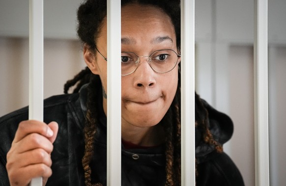 FILE - WNBA star and two-time Olympic gold medalist Brittney Griner speaks to her lawyers standing in a cage at a court room prior to a hearing, in Khimki just outside Moscow, Russia, Tuesday, July 26 ...