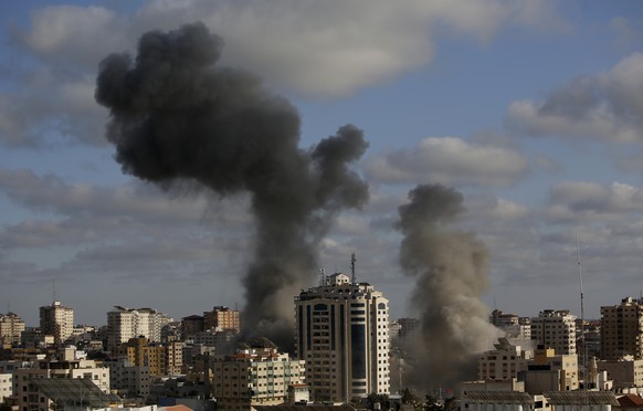 CORRECTS THE DATE AND BUILDING INFORMATION - An Israeli air strike hits a building in Gaza City, Monday, May 17, 2021. The Israeli military unleashed a wave of heavy airstrikes Monday on the Gaza Stri ...