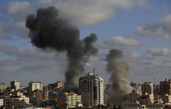 CORRECTS THE DATE AND BUILDING INFORMATION - An Israeli air strike hits a building in Gaza City, Monday, May 17, 2021. The Israeli military unleashed a wave of heavy airstrikes Monday on the Gaza Stri ...