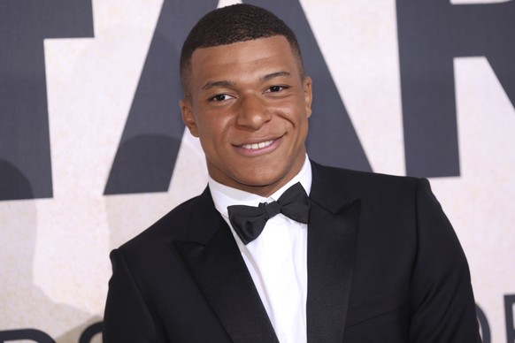 Kylian Mbappe poses for photographers upon arrival at the amfAR Cinema Against AIDS benefit at the Hotel du Cap-Eden-Roc, during the 75th Cannes international film festival, Cap d&#039;Antibes, southe ...