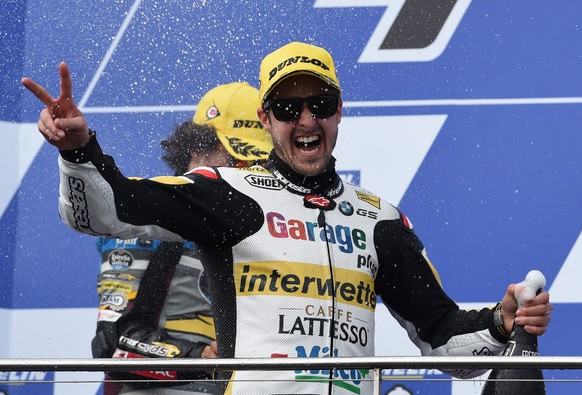 epa05598740 Thomas Luethi of Switzerland for Garage Plus Interwetten celebrates his victory in the Moto2 class race during the 2016 Australian MotoGP at Phillip Island, Victoria, Australia, 23 October ...