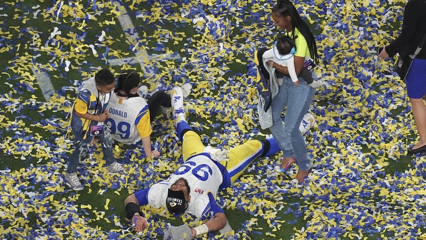 Los Angeles Rams defensive end Aaron Donald (99) celebrates with his family after his team won the NFL Super Bowl 56 football game against the Cincinnati Bengals,Sunday, Feb. 13, 2022, in Inglewood, C ...