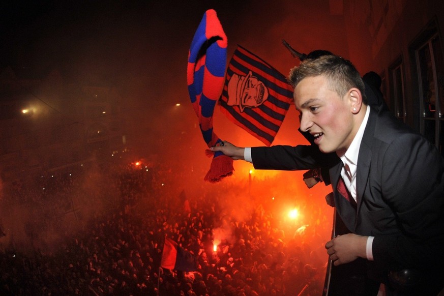 FC Basel&#039;s Xherdan Shaqiri celebrates on the Barfuesserplatz after winning the Swiss Super League soccer championship in the city center of Basel, Switzerland, Sunday, May 16, 2010. (KEYSTONE/Geo ...
