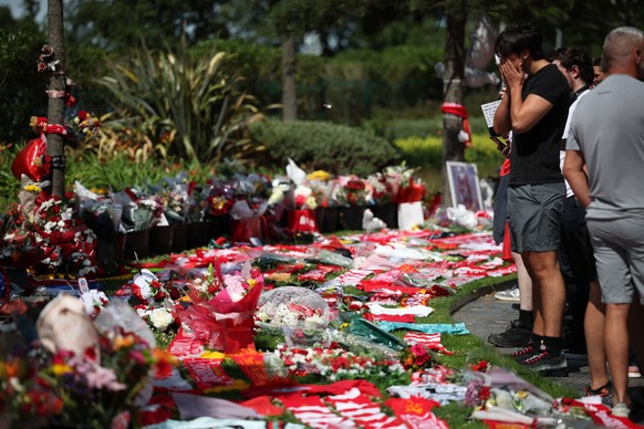 epa12212793 People view the tributes to soccer player Diogo Jota at Anfield, the home of Liverpool FC in Liverpool, Britain 03 July 2025. Jota died in a car accident in Spain together with his brother ...