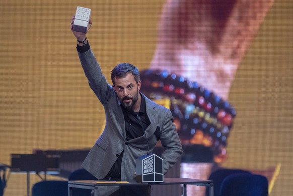 epa07376186 Swiss singer Bligg receives an award for the &#039;Best Album&#039; during the Swiss Music Awards 2019 ceremony in Lucerne, Switzerland, 16 February 2019. EPA/URS FLUEELER