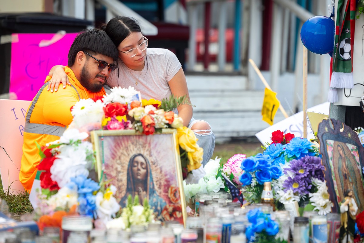 Albert Salgado, left, is comforted by his girlfriend at the site where his uncle Lorenzo Salgado Araujo was shot by an ICE officer in Houston on Friday, July 10, 2026. (AP Photo/Annie Mulligan)
Immigr ...
