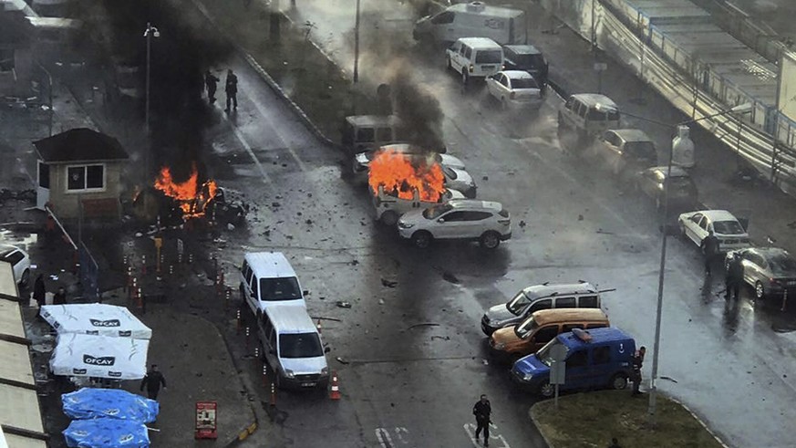 FILE - In this Jan. 5, 2017 file photo, cars burn after a car bomb explosion in Izmir, Turkey. Kurdish militant group TAK claimed responsibility for the Izmir attack, which killed a policeman and a co ...