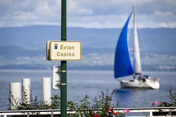 epa13020208 A sign for the Casino is backdropped by a sailing boat on Lake Geneva, in Evian-les-Bains, France, 06 June 2026. The 52nd G7 Summit will take place from 15 to 17 June 2026 in Evian-les-Bai ...