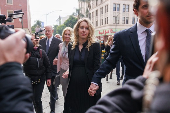 epa10313033 Elizabeth Holmes (C), the founder of the failed blood testing start-up company Theranos, arrives at the Robert F. Peckham Federal Building and US Courthouse for her sentencing hearing in S ...