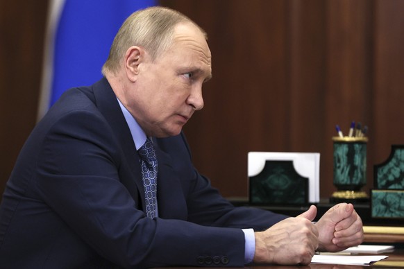 Russian President Vladimir Putin listens to Mahmud-Ali Kalimatov, the head of the Republic of Ingushetia during their meeting in Moscow, Russia, Wednesday, March 30, 2022. (Mikhail Klimentyev, Sputnik ...