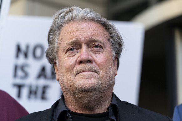 Former White House strategist Steve Bannon, pauses as he departs federal court on Friday, July 22, 2022, in Washington. Bannon, a longtime ally of former President Donald Trump has been convicted of c ...