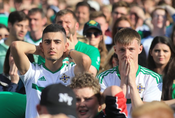 epa05390586 Northern Ireland fans watch their team facing Wales in the UEFA EURO 2016 Round of 16 during a public viewing in Boucher Road Fan Zone, Belfast, Northern Ireland, Britain, Saturday, 25 Jun ...