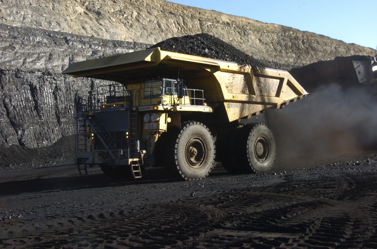 FILE - In this Nov. 15, 2016 file photo, a haul truck with a 250-ton capacity carries coal from the Spring Creek strip mine near Decker, Mont. President Trump's latest move to support coal mining ...