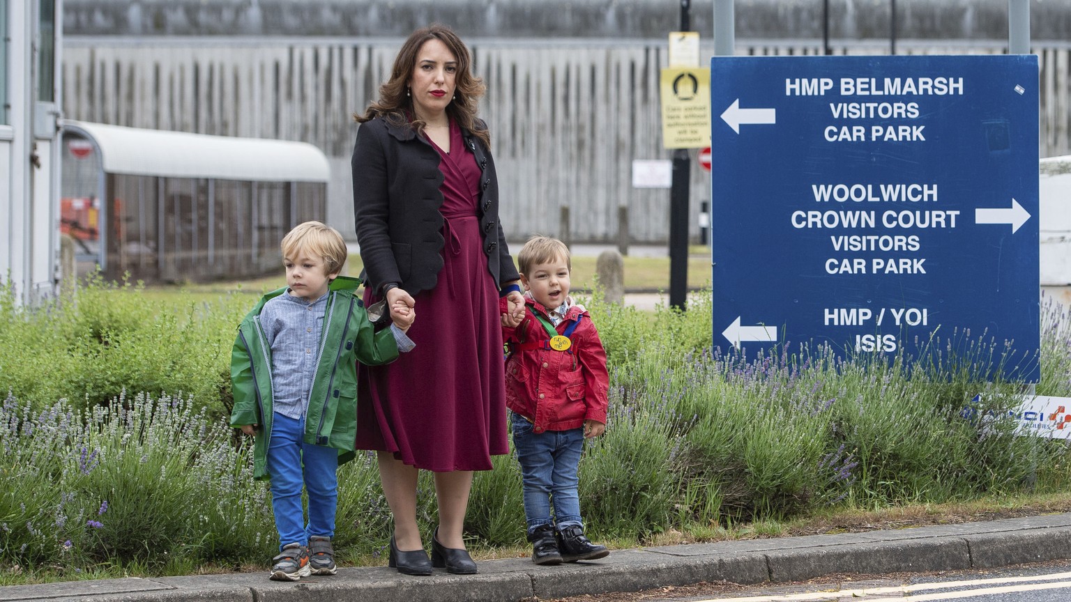 Stella Moris stands with her children Gabriel, four, left, and Max, two, outside Belmarsh Prison, following a visit to her partner and their father Julian Assange in London, Saturday June 19, 2021. As ...