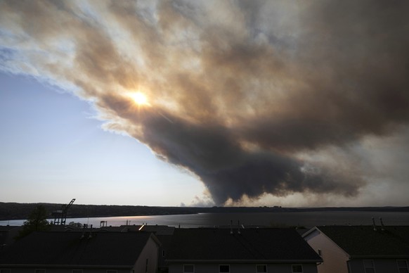 Thick plumes of heavy smoke fill the Halifax sky as an out-of-control fire in a suburban community quickly spread, engulfing multiple homes and forcing the evacuation of local residents, in Halifax, N ...