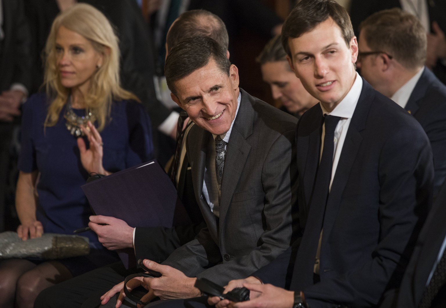 epa05791639 Embattled National Security Advisor Michael Flynn (C) flanked by Kellyanne Conway (L) and Jared Kushner (R) attends a press conference with US President Donald J. Trump and Canadian Prime  ...