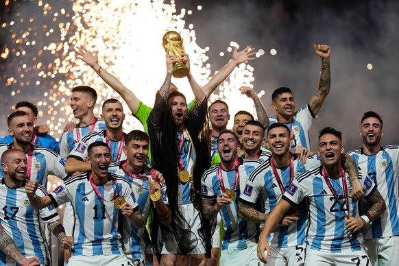 FILE - Argentina's Lionel Messi lifts the trophy after winning the World Cup final soccer match between Argentina and France at the Lusail Stadium in Lusail, Qatar, on Dec. 18, 2022. (AP Photo/Ma ...