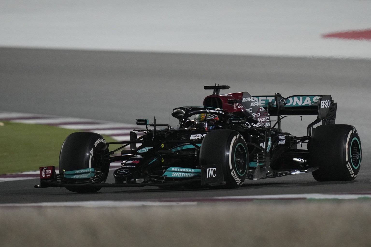 Mercedes driver Lewis Hamilton of Britain in action during the Qatar Formula One Grand Prix. In Lusail, Qatar, Saturday, Nov. 21, 2021. (AP Photo/Darko Bandic)