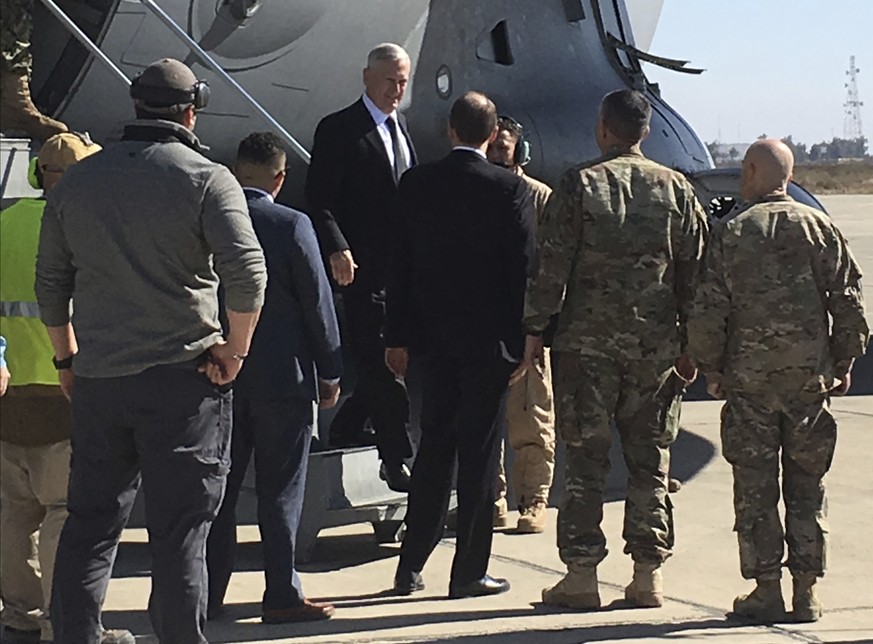 U.S. Secretary of Defense Jim Mattis, center, arrives at Baghdad International Airport, Iraq, on an unannounced trip Monday, Feb. 20, 2017. Mattis said Monday the United States does not intend to seiz ...