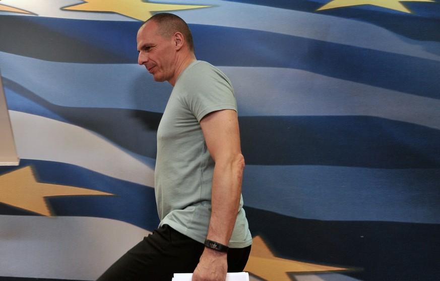 Greece&#039;s Finance Minister Yanis Varoufakis arrives for statements after the results of referendum in Athens, Sunday, July 5, 2015. Greece faced an uncharted future as its interior ministry predic ...