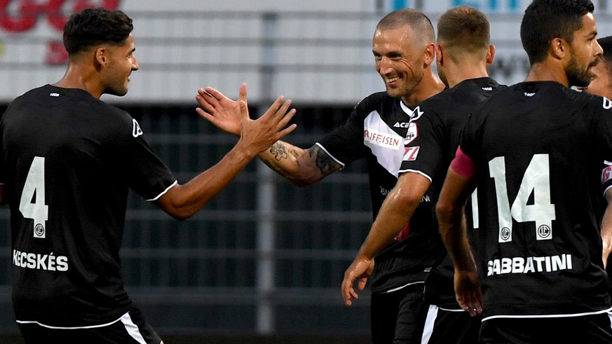 Lugano's player Alexander Gernt, center, celebrates the 1 - 0 goal with his team, during the Super League soccer match FC Lugano against FC Luzern, at the Cornaredo stadium in Lugano, Saturday, S ...