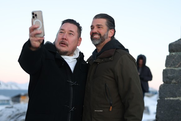 Donald Trump Jr., right, poses for a photo as he arrives in Nuuk, Greenland, Tuesday, Jan. 7, 2025. (Emil Stach/Ritzau Scanpix via AP)